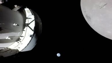 A camera on Orion's solar array wing captures a view of the spacecraft, the Earth and the Moon during the spacecraft's outbound powered flyby of the Moon as part of the Artemis I mission November 21, 2022 in a still image from video. Artemis I, the first flight test of NASA's Orion capsule and Space Launch System rocket, launched November 16, 2022, and is scheduled to splashdown December 11. NASA TV/Handout via REUTERS THIS IMAGE HAS BEEN SUPPLIED BY A THIRD PARTY.